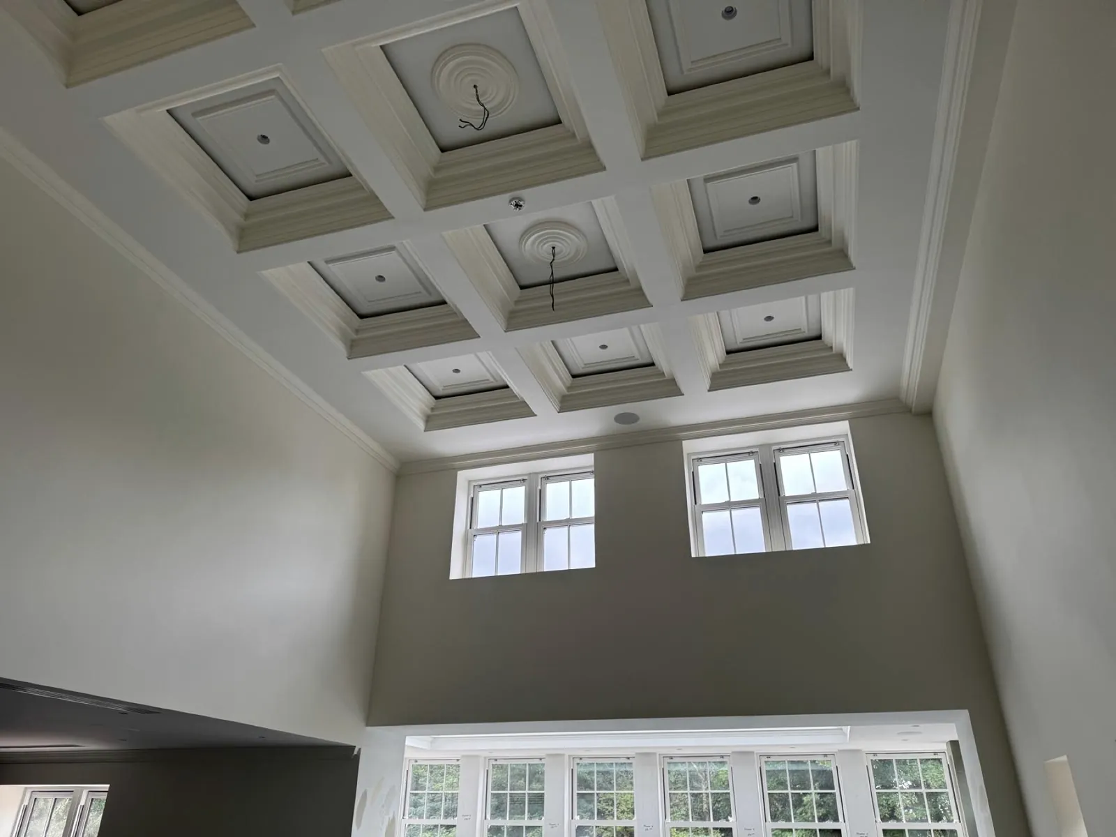 Double-height room with a coffered ceiling