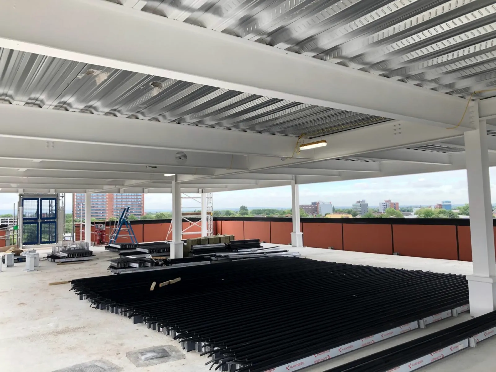 Intumescent-coated steel columns and beams on an open upper floor of a commercial building
